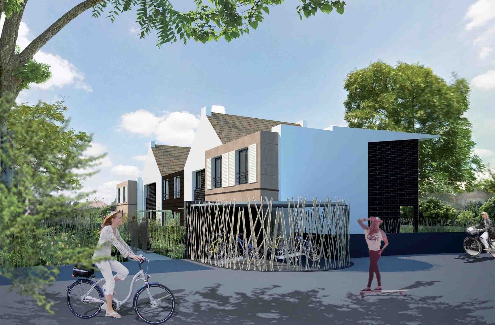 Maisons de ville à toits à deux pans et bardage bois, le long d’une rue où passent des cyclistes